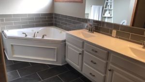 tile updated around bathtub and double vanity