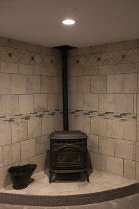 Basement Finish in Wichita KS Pellet stove with custom tile surround