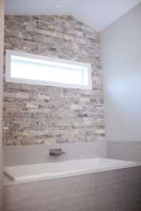 stacked stone accent wall with window