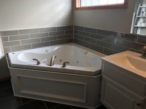 tile surround on whirlpool tub in Master