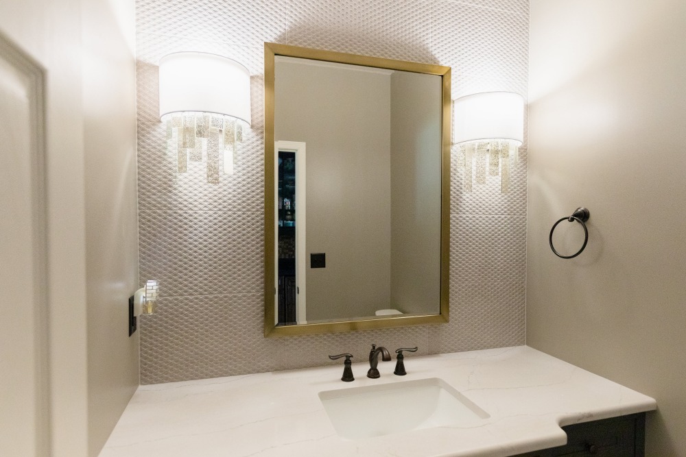 Brushed gold mirror - powder bath remodel